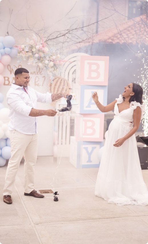 Gender reveal celebration with confetti and sparks