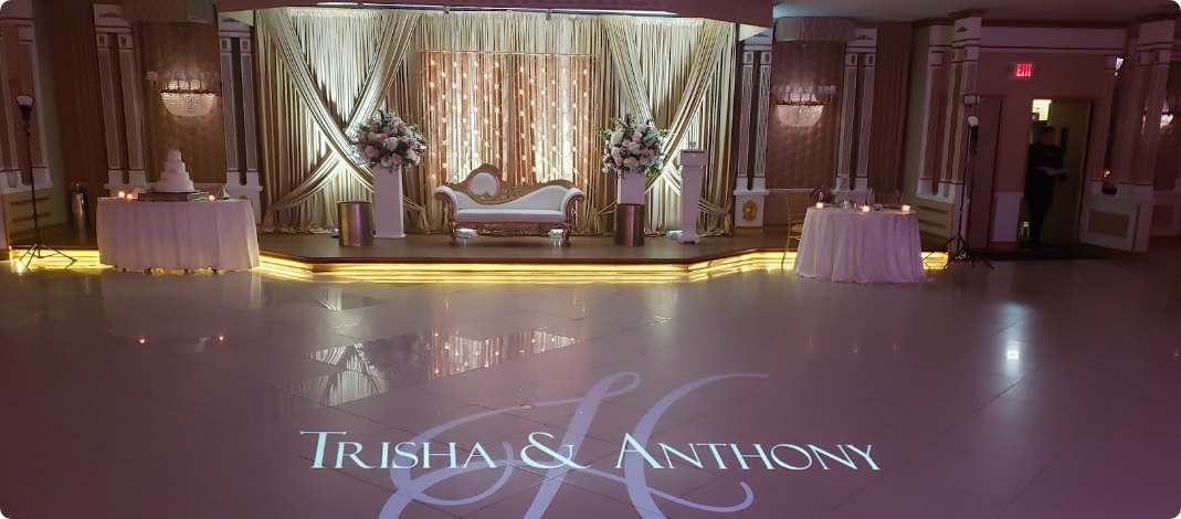 Custom monogram projected across a wedding dance floor