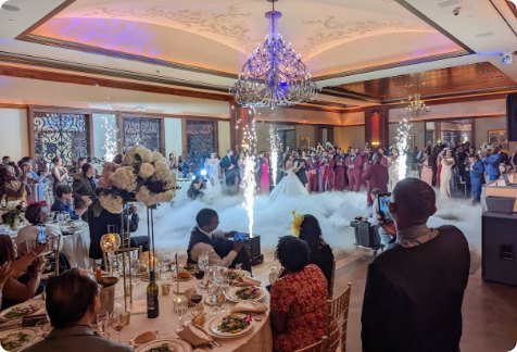 Sparks and low fog under a ballroom chandelier